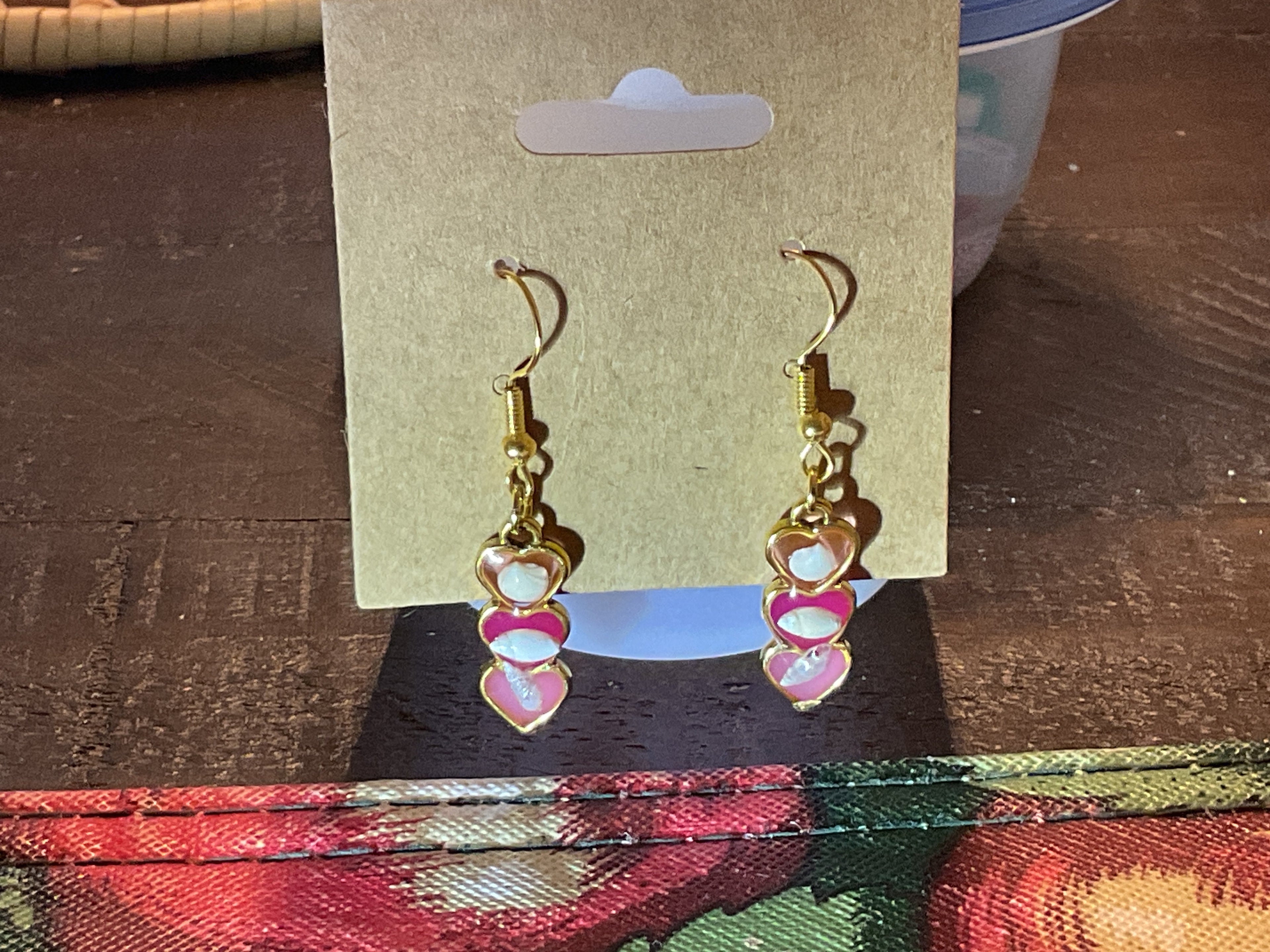 Gold 3 heart dangle earrings with tiny shells in pink hues