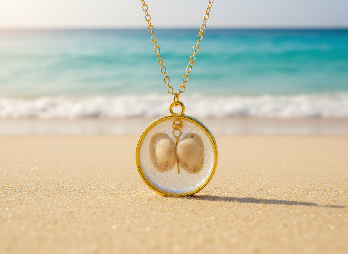 Necklace with a pendant featuring two seashells on a white card.